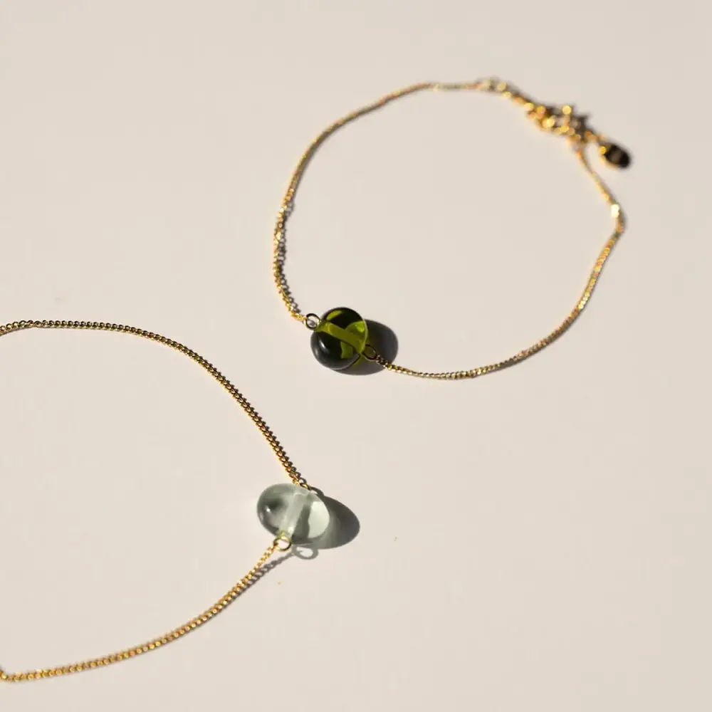 Vinoos Freundschaftsarmband - türkis & grün Frauegschichte - Vinoos Freundschaftsarmband - türkis & grün